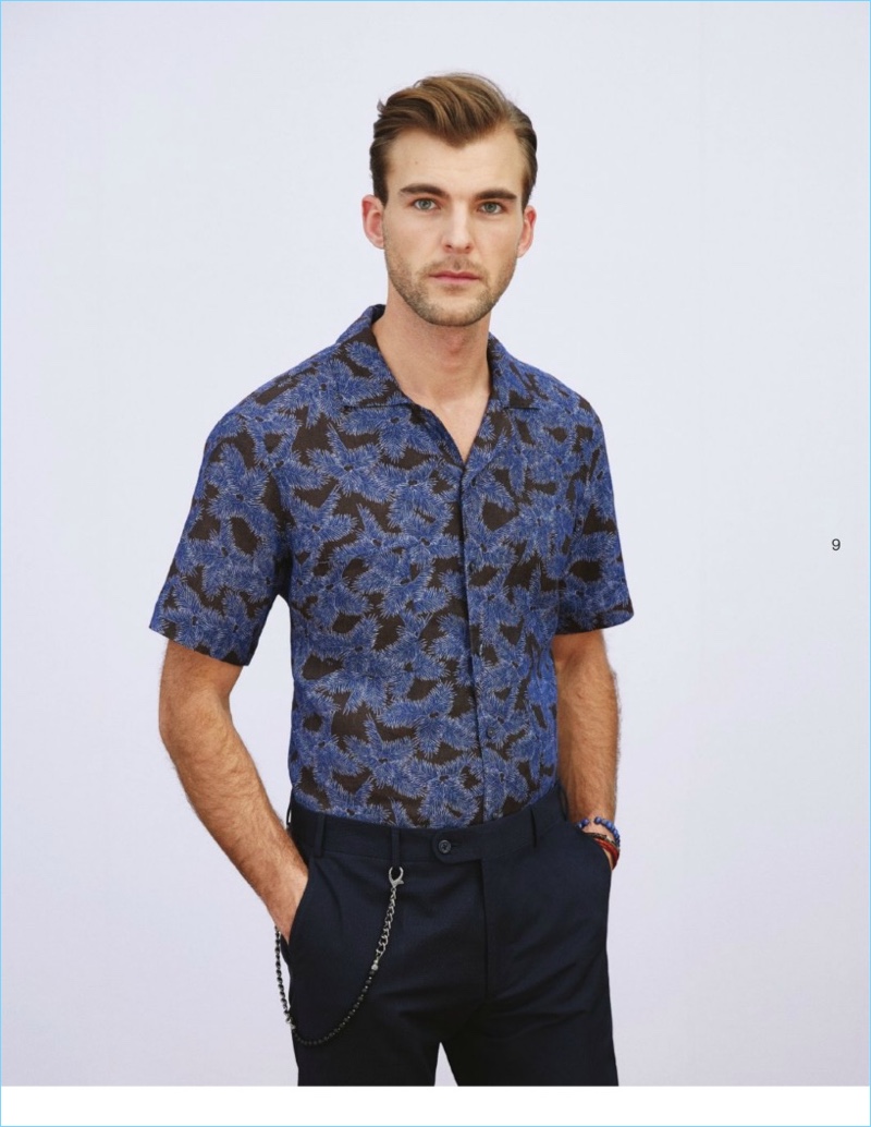 Patrick Kafka dons a short-sleeve patterned shirt with trousers from Beymen Club.