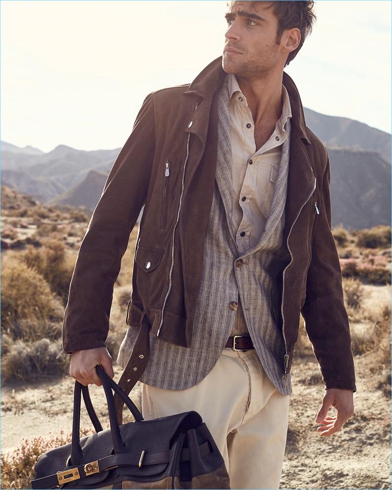 Neiman Marcus makes a case for layering with a look from Brunello Cucinelli. Here, George Alsford dons the brand's suede moto jacket with a striped linen sport jacket. A western style shirt and white denim jeans complete George's look.