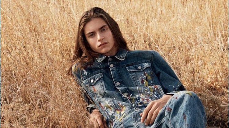Posing in the field, Dylan Christensen stars in Calvin Klein Jeans' spring-summer 2018 campaign.