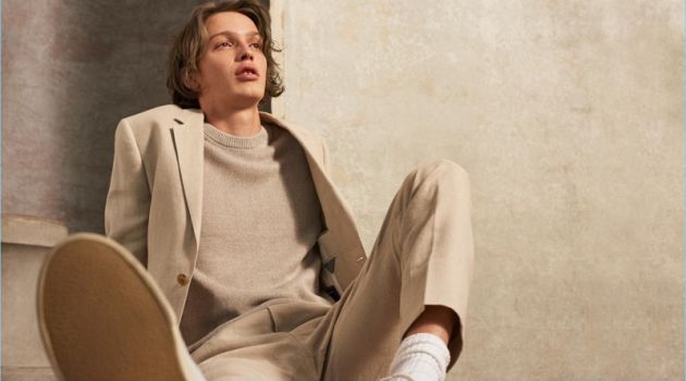 Linen Days: Lucas Satherley for Club Monaco Embracing spring, Lucas Satherley wears a neutral colored look by Club Monaco. He sports a linen crew, blazer, and trousers with Veja sneakers.