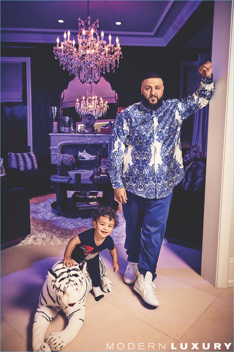 Appearing in a photo shoot, DJ Khaled poses with his son Asahd.