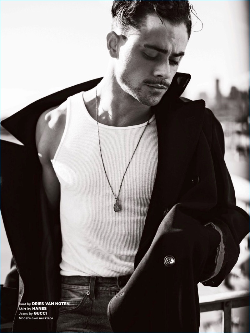 Actor Dacre Montgomery wears a Dries Van Noten coat with a Hanes tank and Gucci jeans. 