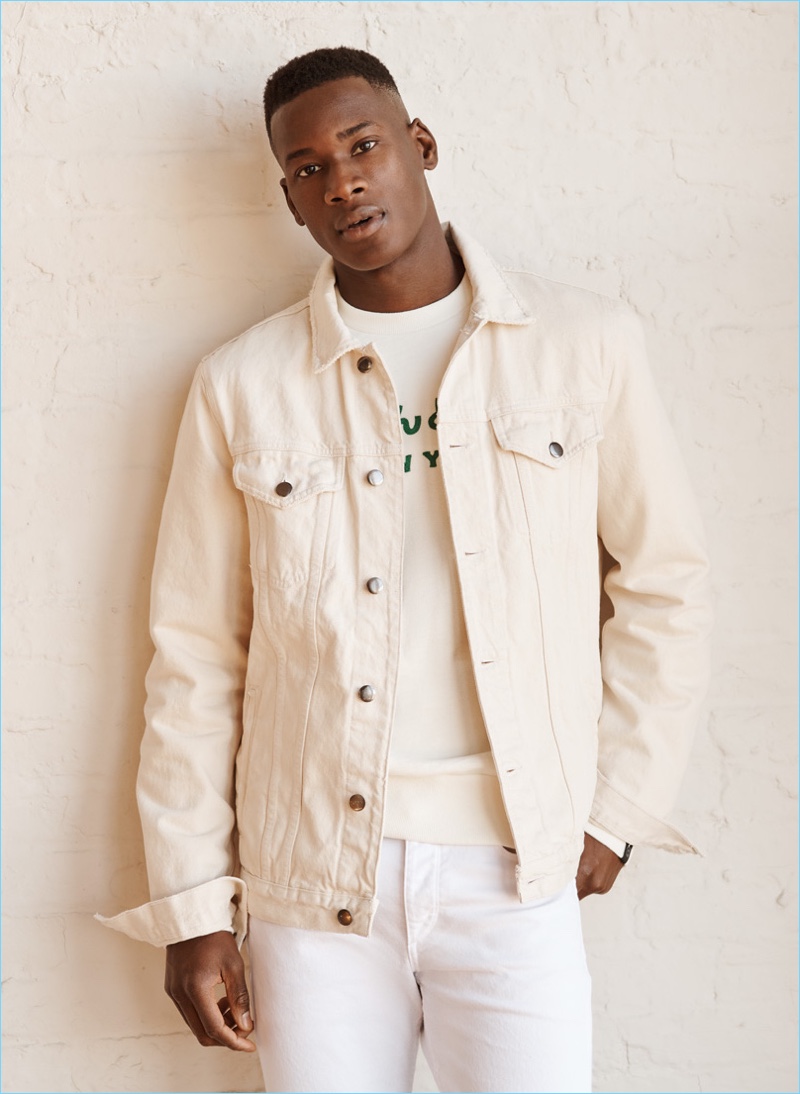 Get Toned: David Agbodji wears a Frame denim jacket and Rag & Bone sweatshirt. He also sports Rag & Bone Standard Issue jeans and Bally sneakers.