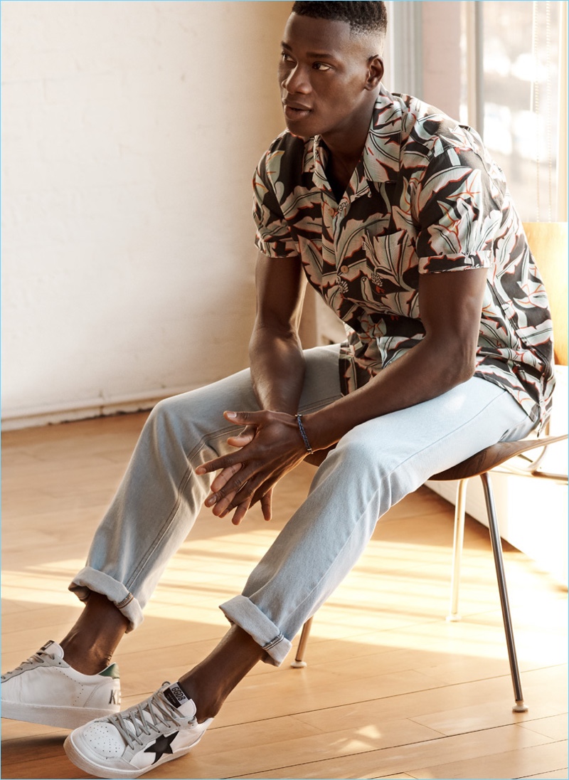Tropical Punch: David Agbodji sports a Levi's Red Tab camp shirt with AMI jeans, a Scosha bracelet and Golden Goose sneakers.