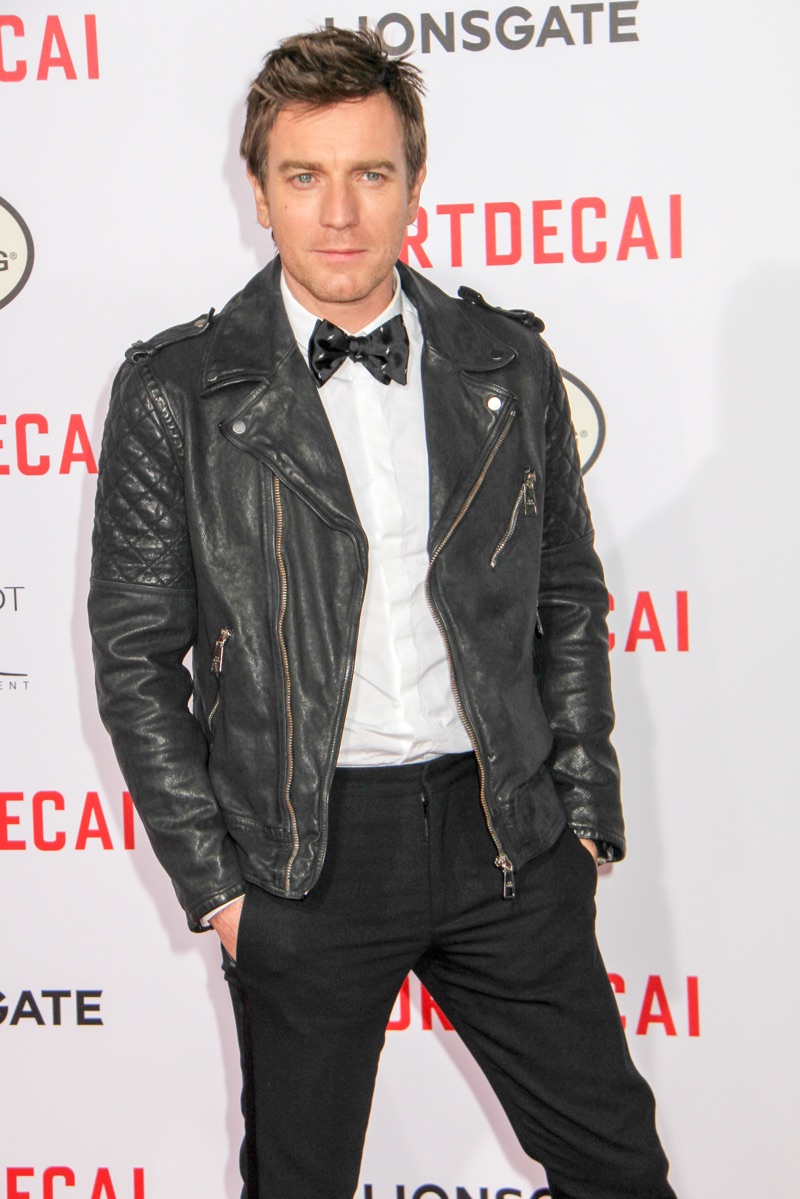 Ewan McGregor hits the red carpet for the premiere of Mortdecai in a black leather biker jacket with a bow-tie, white dress shirt, and black trousers.