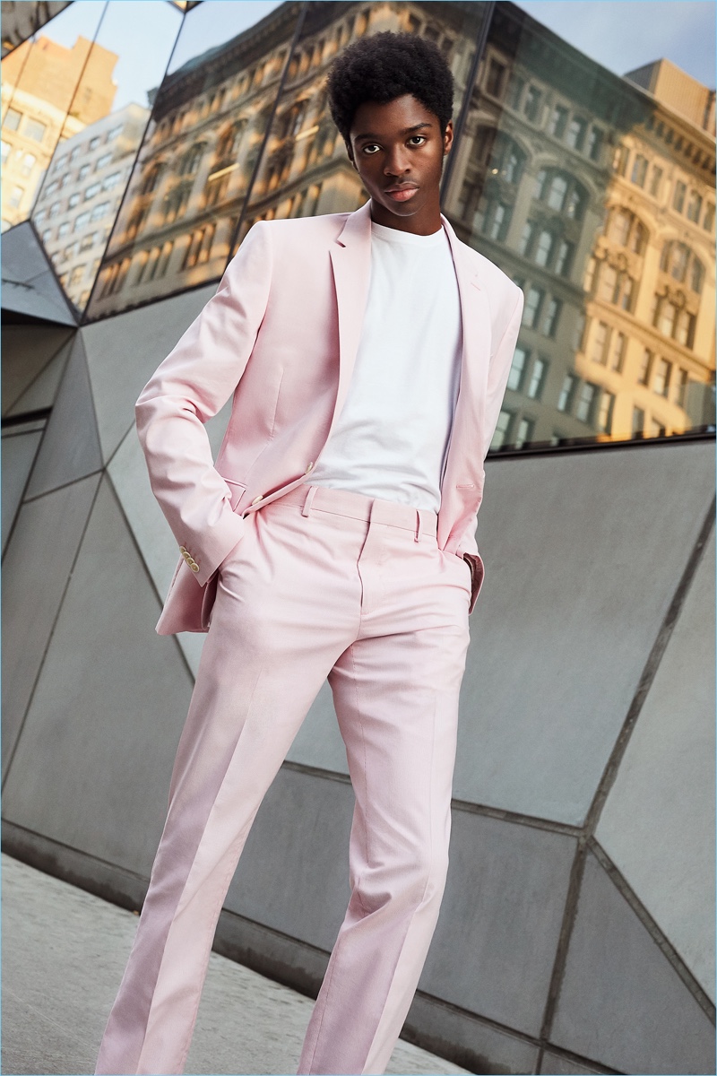 Model Alton Mason dons a pink suit from Express' latest lineup.