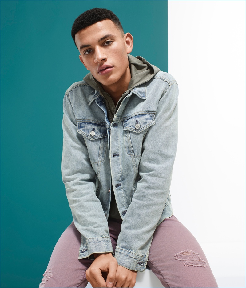 Adil Haddaoui wears a Gap distressed denim jacket and dusty mauve jeans.