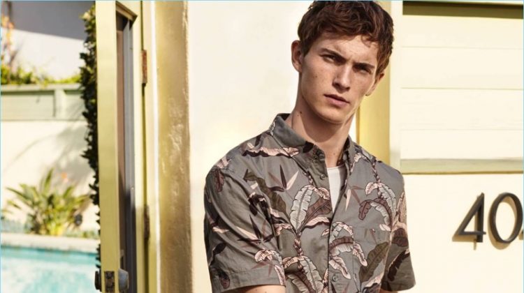 Model Luc Defont-Saviard dons a printed short-sleeve shirt from H&M.