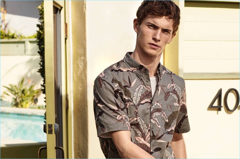 Model Luc Defont-Saviard dons a printed short-sleeve shirt from H&M.