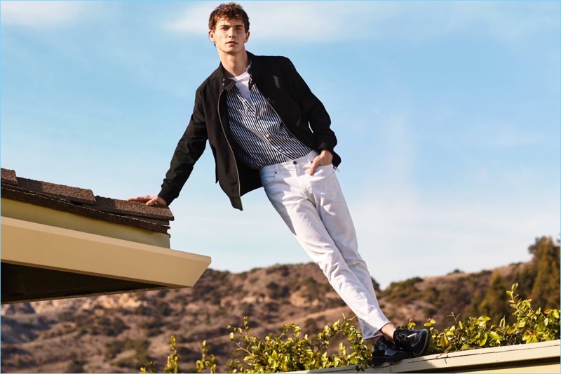 A casual vision, Luc Defont-Saviard sports a H&M jacket with a short-sleeve striped shirt and skinny-fit pants in white.