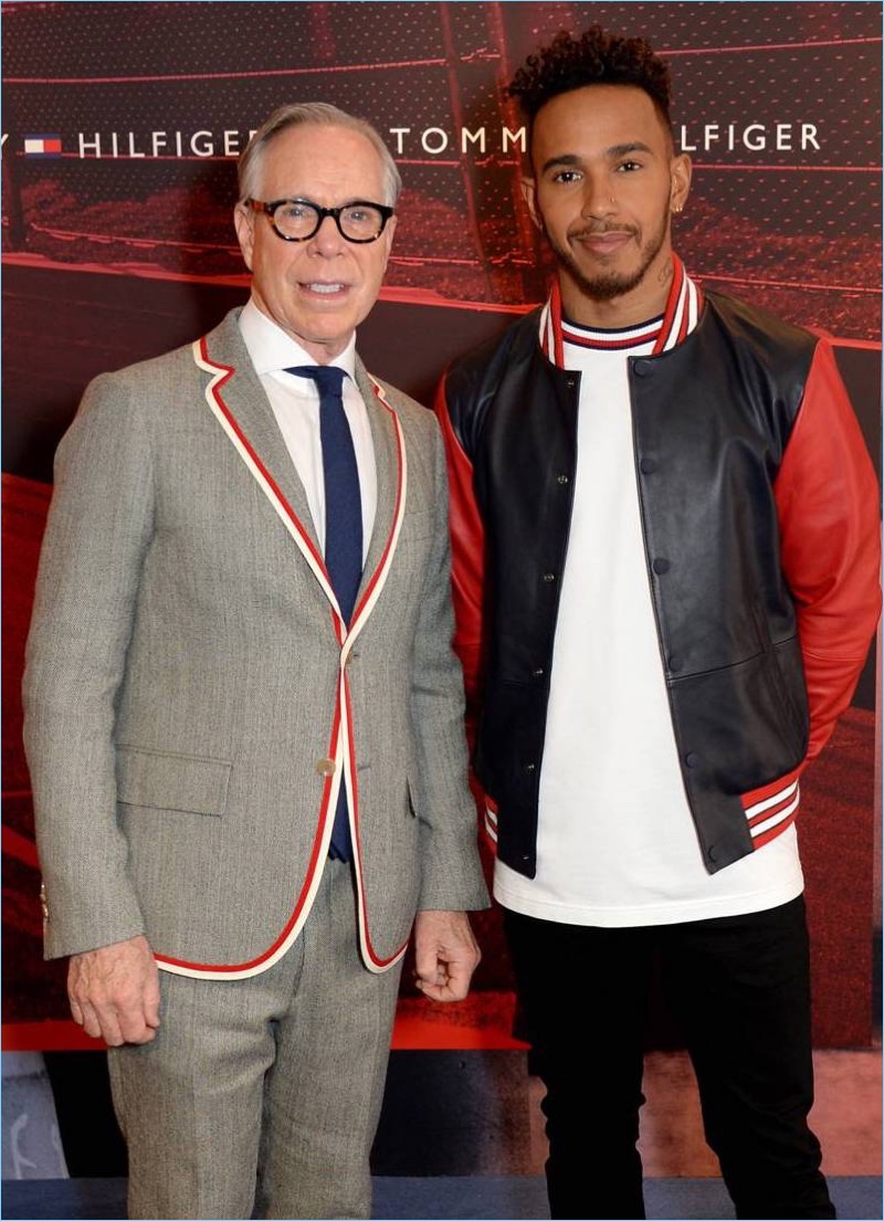 Tommy Hilfiger poses for a photo with Lewis Hamilton.