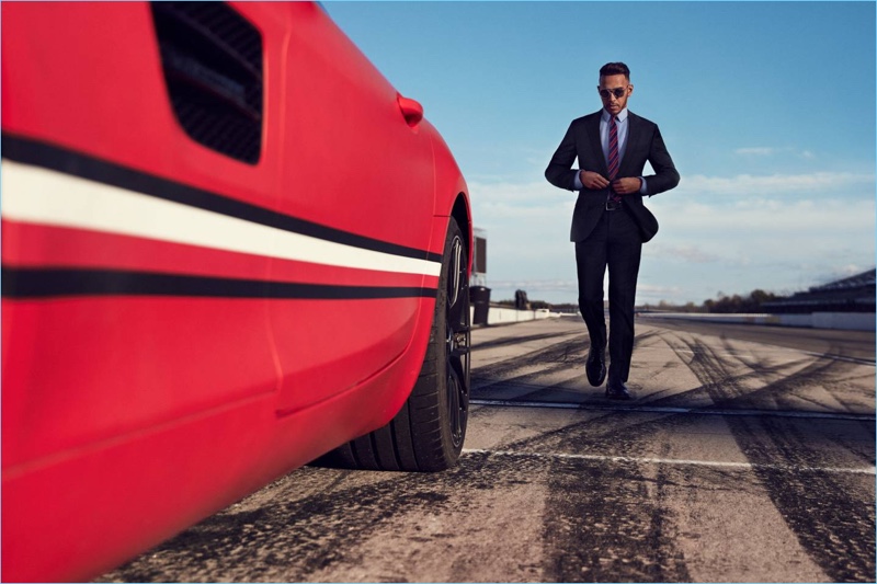 Suiting up, Lewis Hamilton wears a sharp number by Tommy Hilfiger.