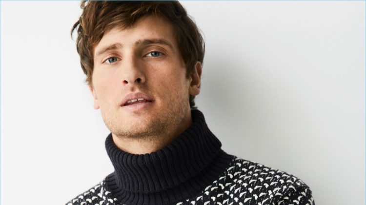 Sporting a textured turtleneck sweater, Tom Warren wears Marc O'Polo.