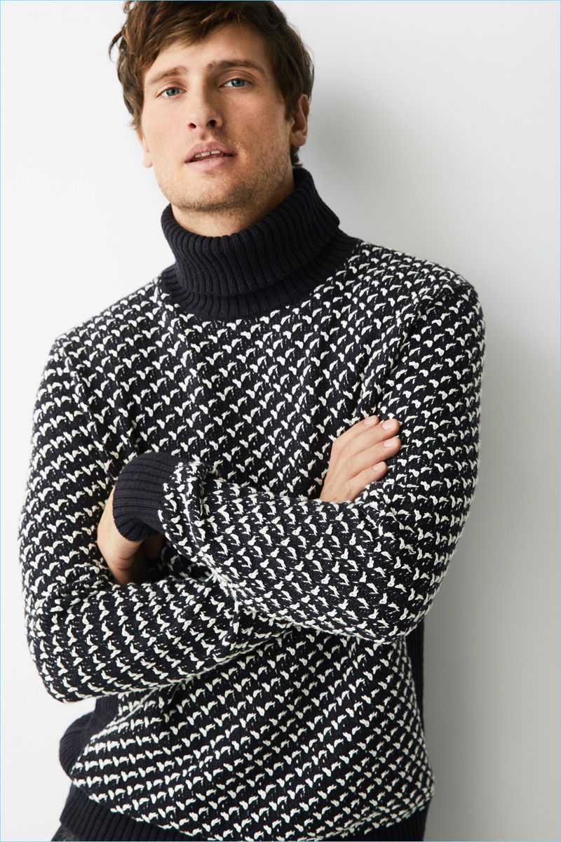 Sporting a textured turtleneck sweater, Tom Warren wears Marc O'Polo.