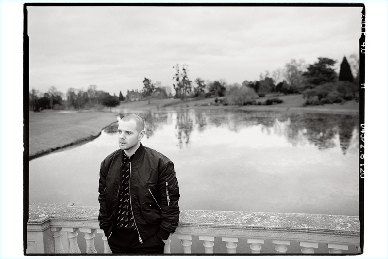 Venturing outdoors, Mike Skinner wears an Acne Studios bomber with a Balenciaga shirt, and Neil Barrett trousers.