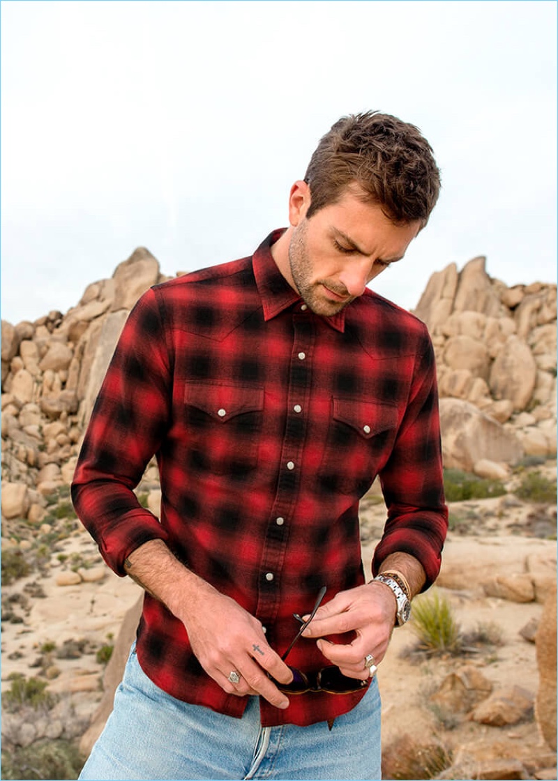 Rocking a red and black check shirt with jeans, Rafael Lazzini links up with Proper Cloth.