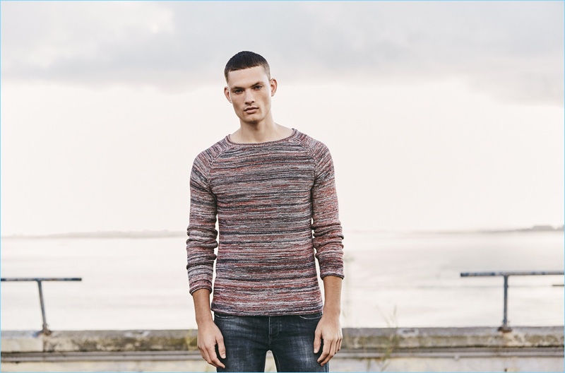 Sporting an essential knit sweater, William Los connects with Q/S designed by for spring.