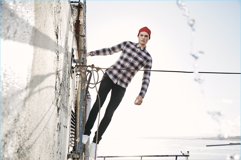 A modern vision, William Los wears a plaid shirt and skinny jeans from Q/S designed by.