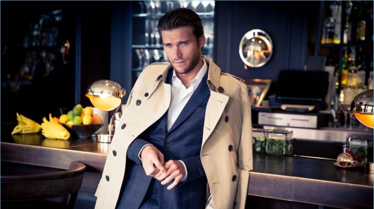 A striking vision, Scott Eastwood wears a Salvatore Ferragamo suit with a Burberry trench.