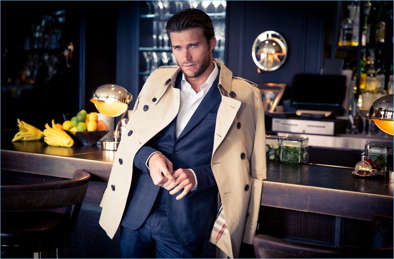 A striking vision, Scott Eastwood wears a Salvatore Ferragamo suit with a Burberry trench.