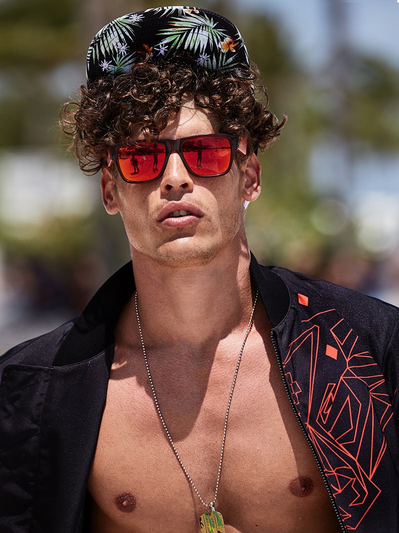 Sidney wears jacket Marcelo Burlon, sunglasses Givenchy, and necklace John Hardy.