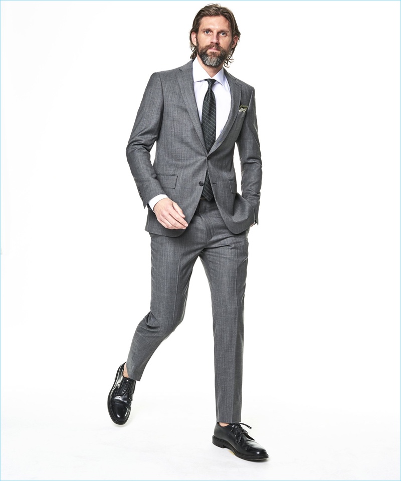 RJ Rogenski models a Todd Snyder White Label Sutton stretch tropical wool suit in light charcoal.