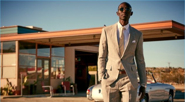 Looking sharp, Armando Cabral wears a Todd Snyder White Label Sutton windowpane linen suit in grey.