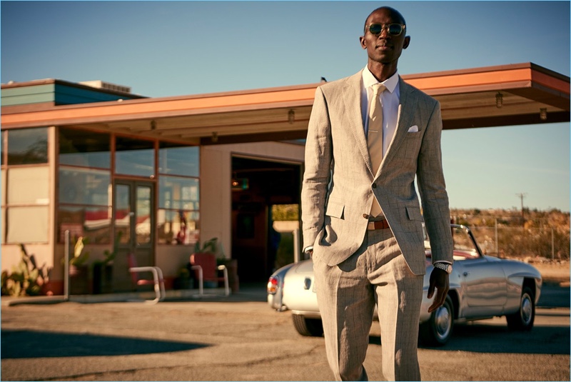 Looking sharp, Armando Cabral wears a Todd Snyder White Label Sutton windowpane linen suit in grey.