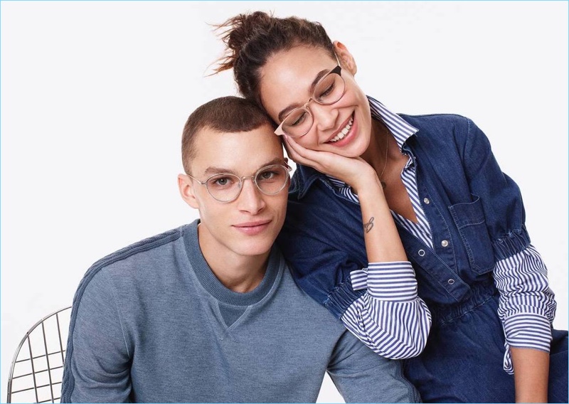 Embracing a round frame, Louis Mayhew models Warby Parker's Newland eyeglasses in polished silver.