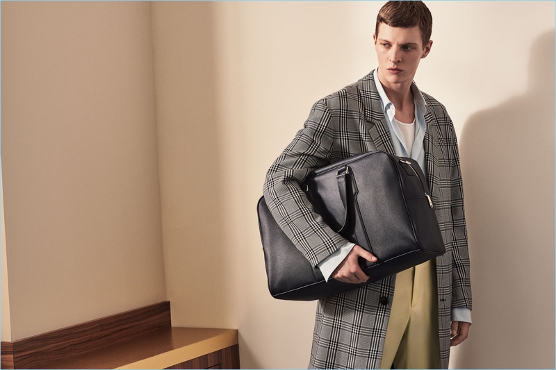 Making a case for checks, Tim Schuhmacher wears a sleek Zara Man coat.