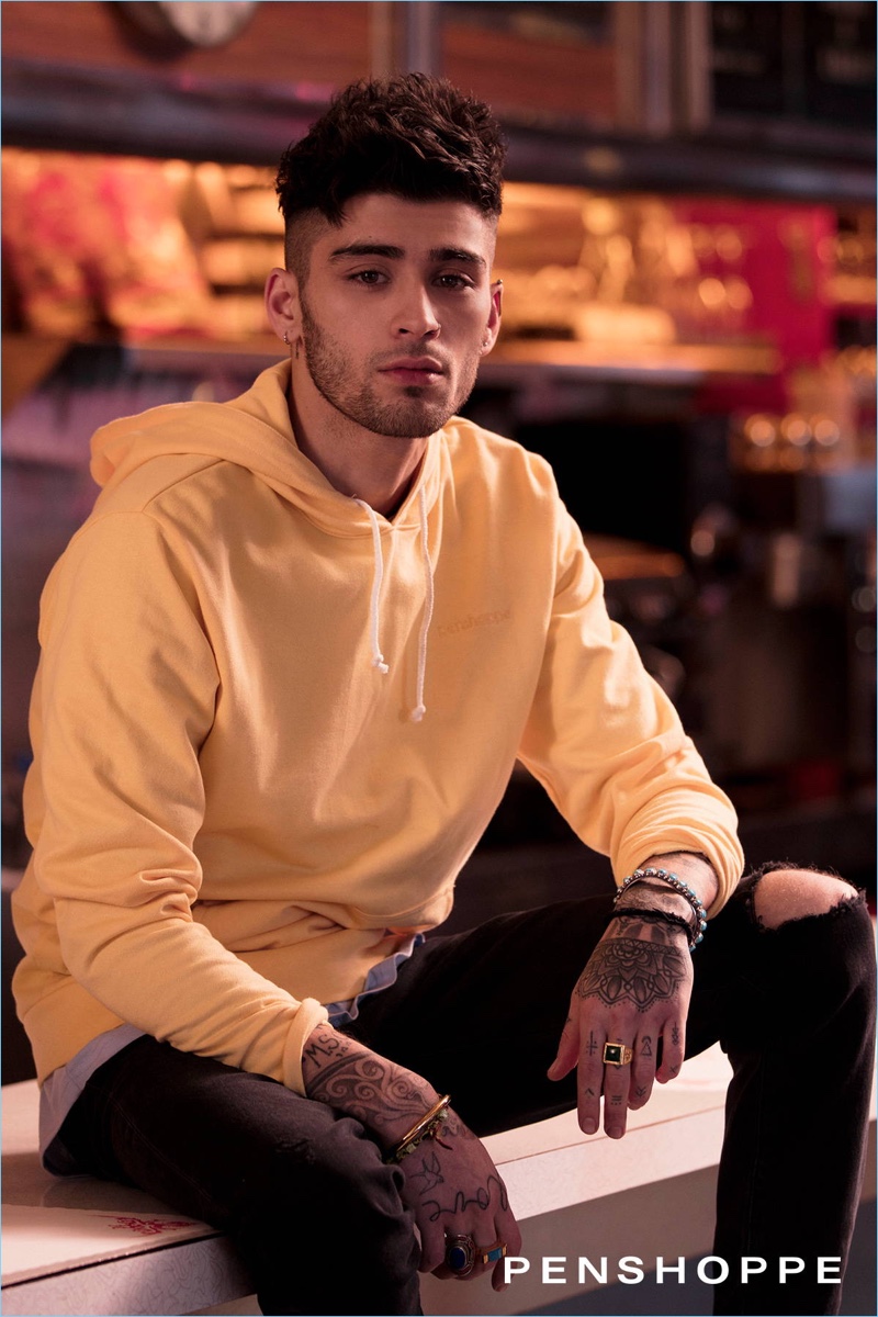 Wearing a yellow hoodie and black jeans, Zayn Malik stars in Penshoppe's spring 2018 campaign.