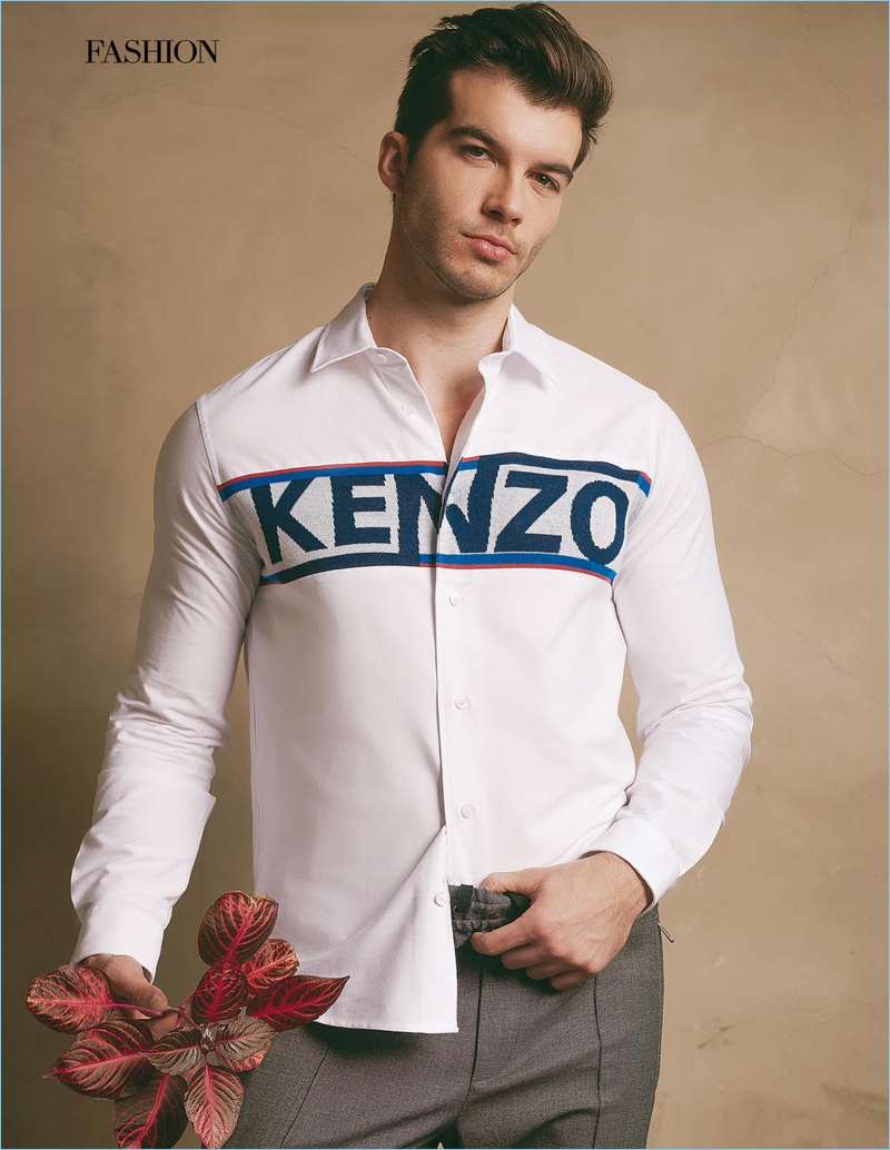 Actor Adam Hagenbuch wears a Kenzo shirt with Theory pants.