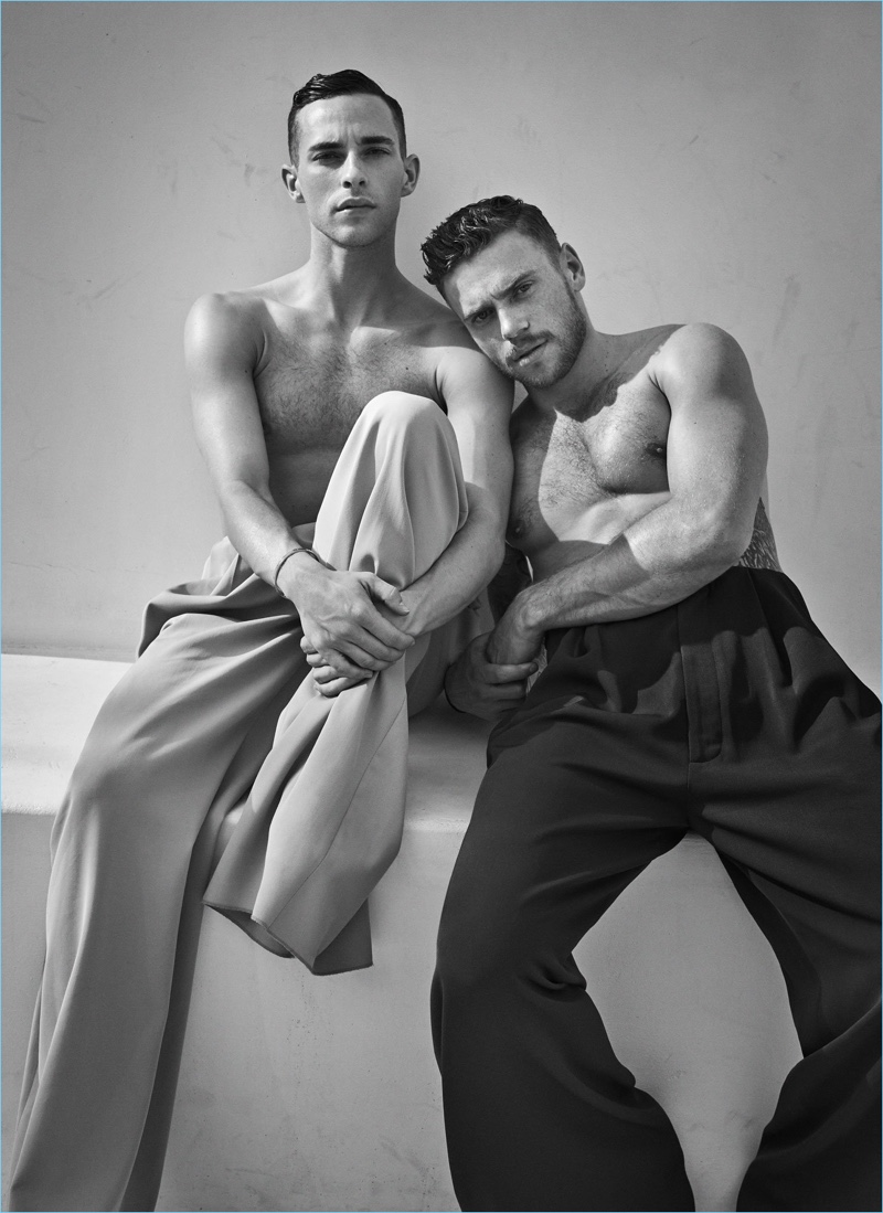 Sporting wide-leg pants by Acne Studios, a shirtless Adam Rippon and Gus Kenworthy appear in an image together.