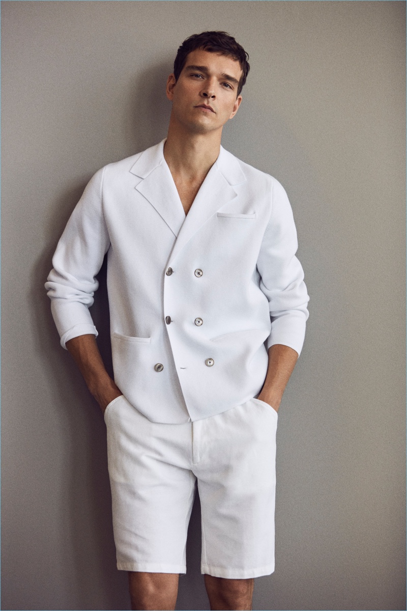 Alexandre Cunha dons an all-white look from Massimo Dutti.