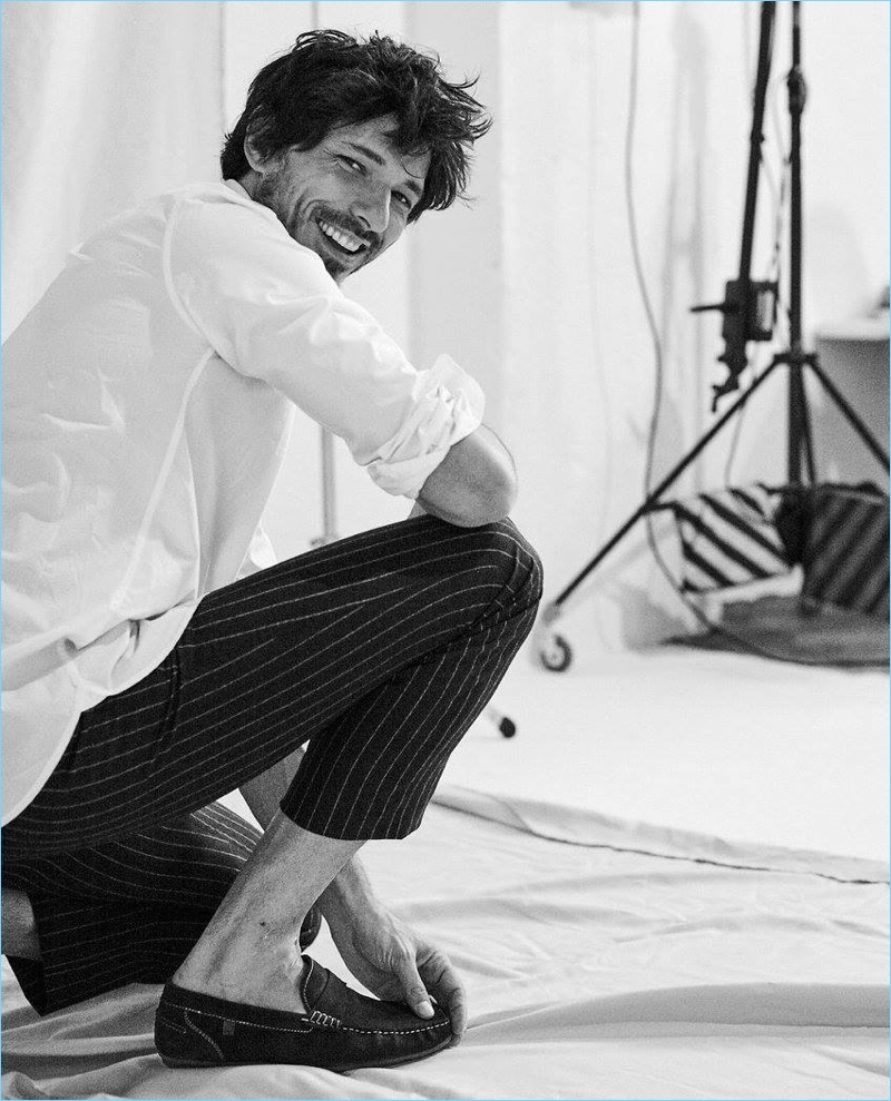 All smiles, Andres Velencoso is captured in a behind the scenes photo for Carmela.