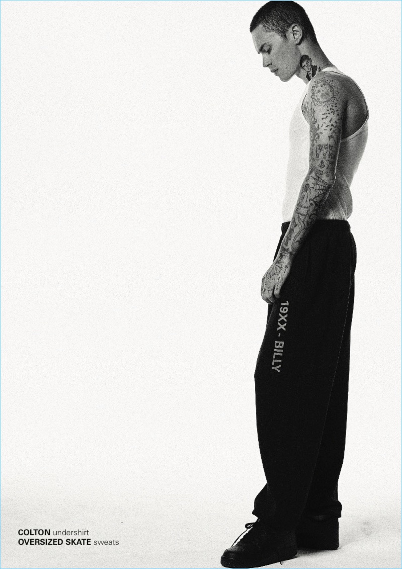 Embracing a sporty flair, Simon Kotyk wears oversized joggers by BILLY.