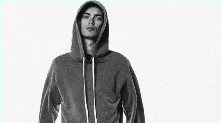 Front and center, Simon Kotyk wears a hoodie and sweats by BILLY.