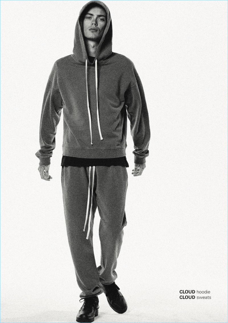 Front and center, Simon Kotyk wears a hoodie and sweats by BILLY.