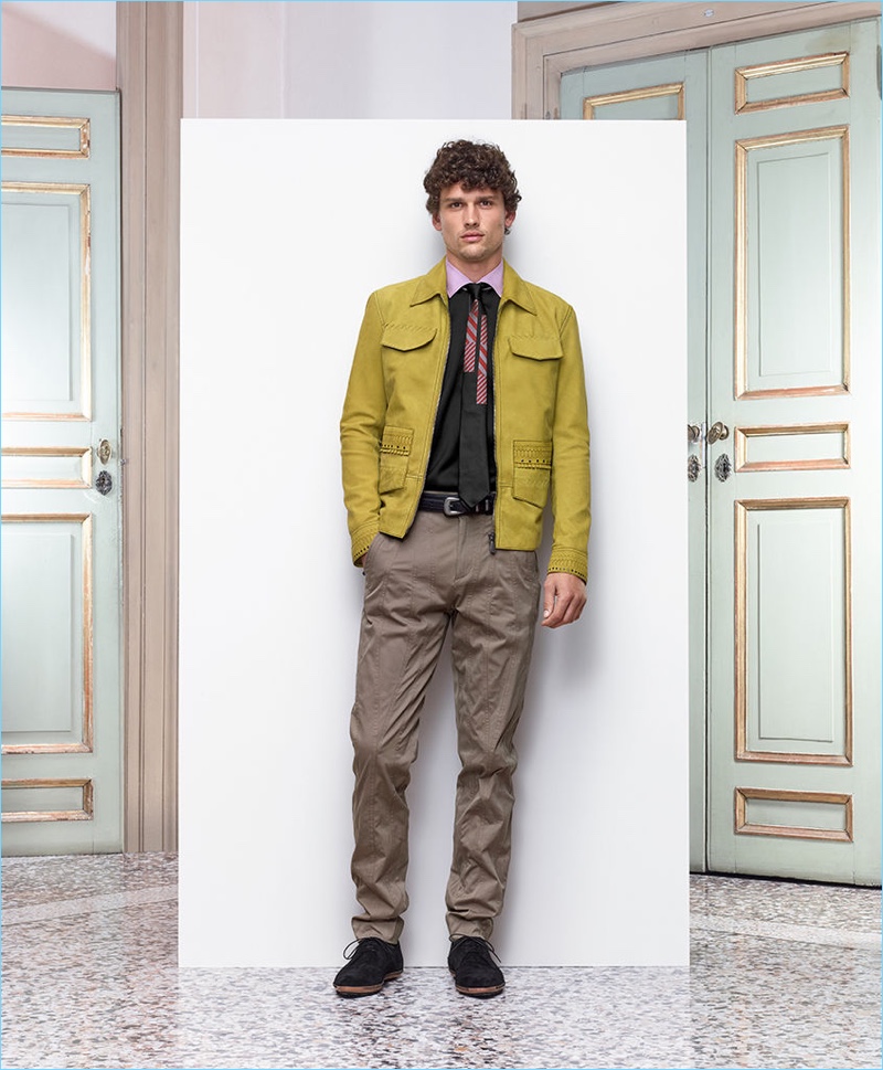 Simon Nessman dons a Bottega Veneta bomber in chamomile suede with woven leather details. The Canadian model also wears cotton trousers and pointy suede shoes.