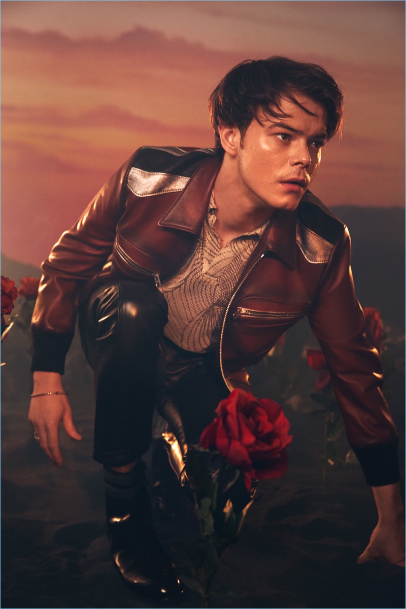 Rocking leather, Charlie Heaton wears a jacket and pants by Coach 1941. He also sports a Dries Van Noten shirt and Jimmy Choo boots.