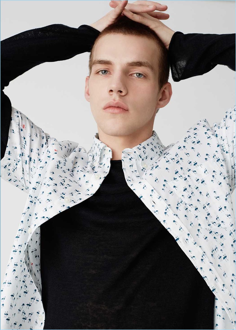 Benji Staker wears a short-sleeve flamingo print shirt from Club Monaco.