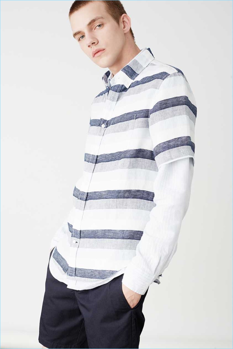 Sporting linen, Benji Staker wears a striped shirt from Club Monaco.