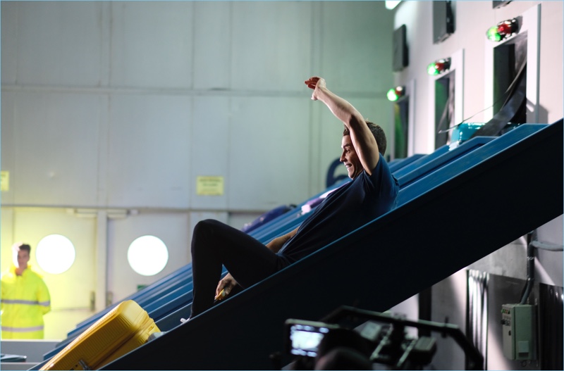 Inseparable from his American Tourister luggage, Cristiano Ronaldo enjoys a ride down the conveyer belt.