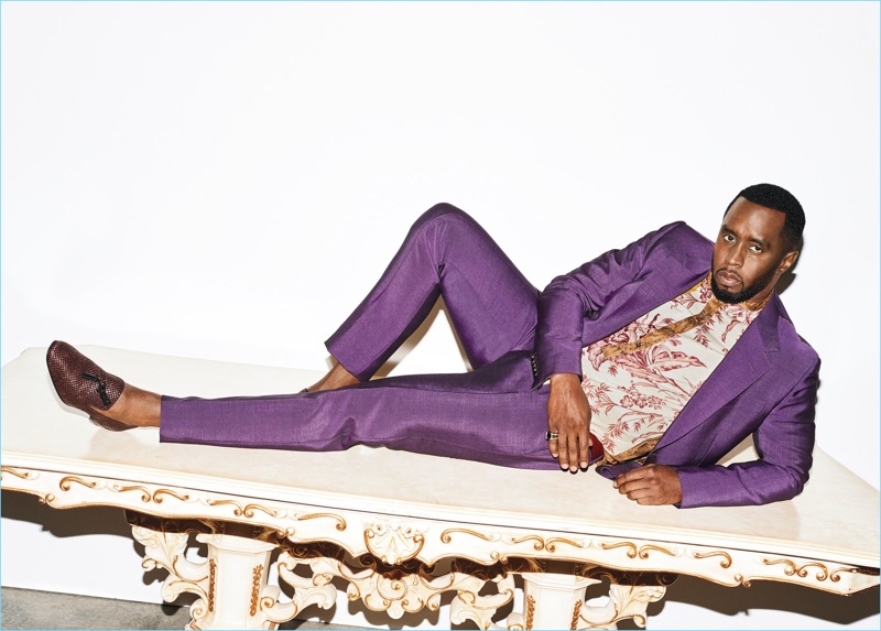 Starring in a photo shoot, Diddy wears a purple Gucci suit with a Pierre-Louis Mascia shirt and Christian Louboutin loafers.