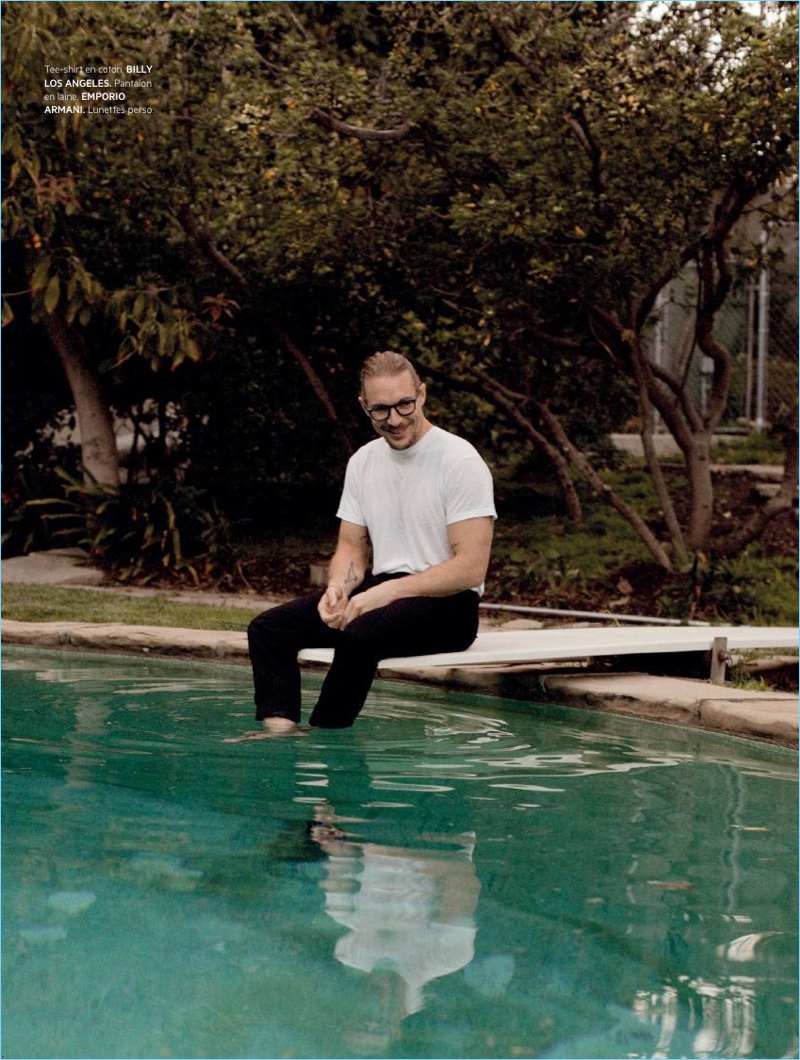 Relaxing poolside, Diplo wears a Billy Los Angeles t-shirt with Emporio Armani pants.
