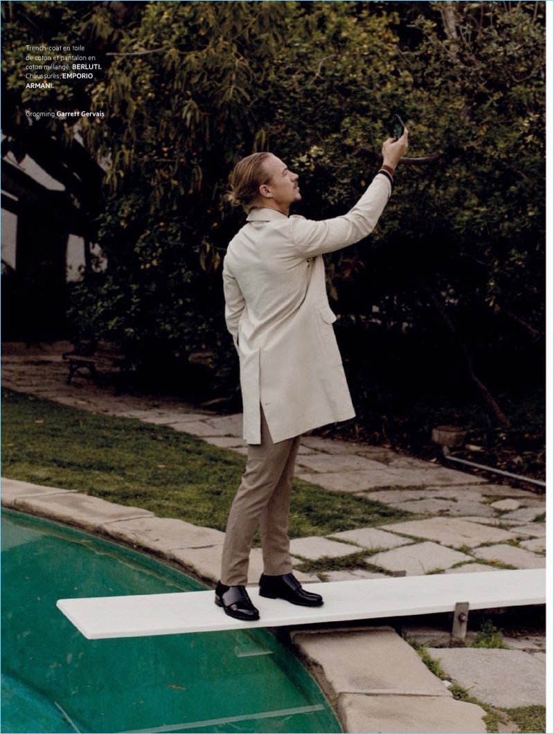 Appearing in a photo shoot, Diplo wears a Berluti trench and pants with Emporio Armani shoes. 