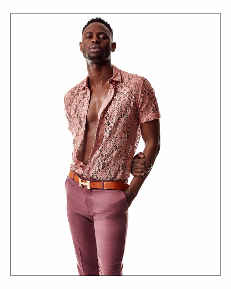 Mac Phiri wears a lace Topman shirt and trousers with an Hermès belt.