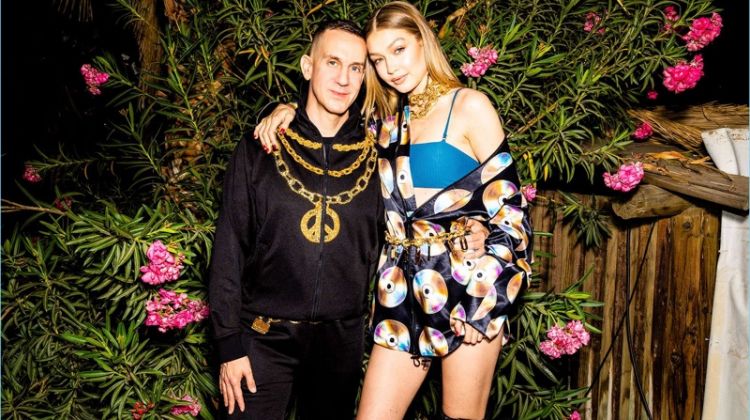 Jeremy Scott and Gigi Hadid wear looks from the H&M x Moschino collaboration collection.