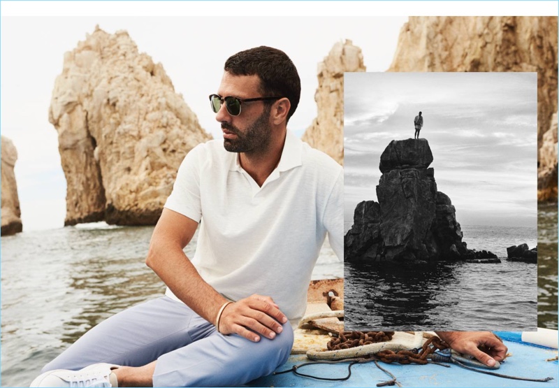 Relaxing, Hugo Parisi wears a H&M polo shirt with cotton chinos and sunglasses.