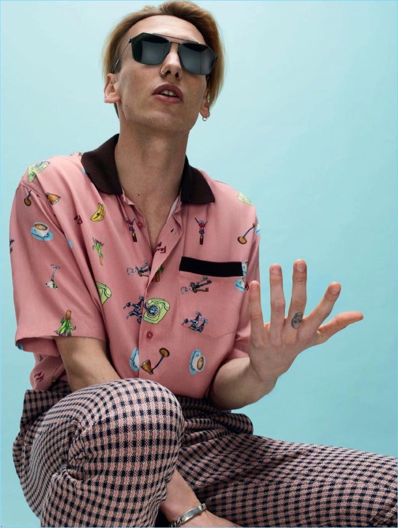 Channeling a retro attitude, Jamie Campbell Bower wears Fendi.